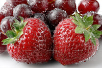 Fresh Ripe Strawberries with Dew Drops and Green Leaves