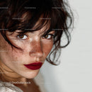 Freckled Woman with Curly Hair and Red Lipstick Portrait