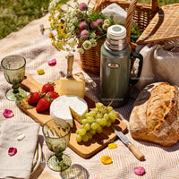 Cozy Outdoor Picnic with Cheese, Bread and Fresh Fruits