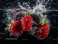 Raspberries and Blackberries Splashing Water Underwater with Bubbles