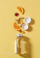 Vitamins and fresh fruit slices on yellow background