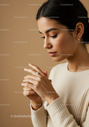 Elegant Young Woman Applying Lotion for Skincare Routine