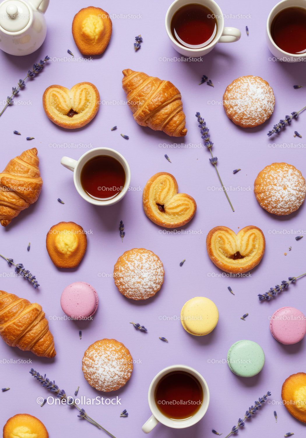 Assorted French Pastries and Tea Cups on Lavender Background