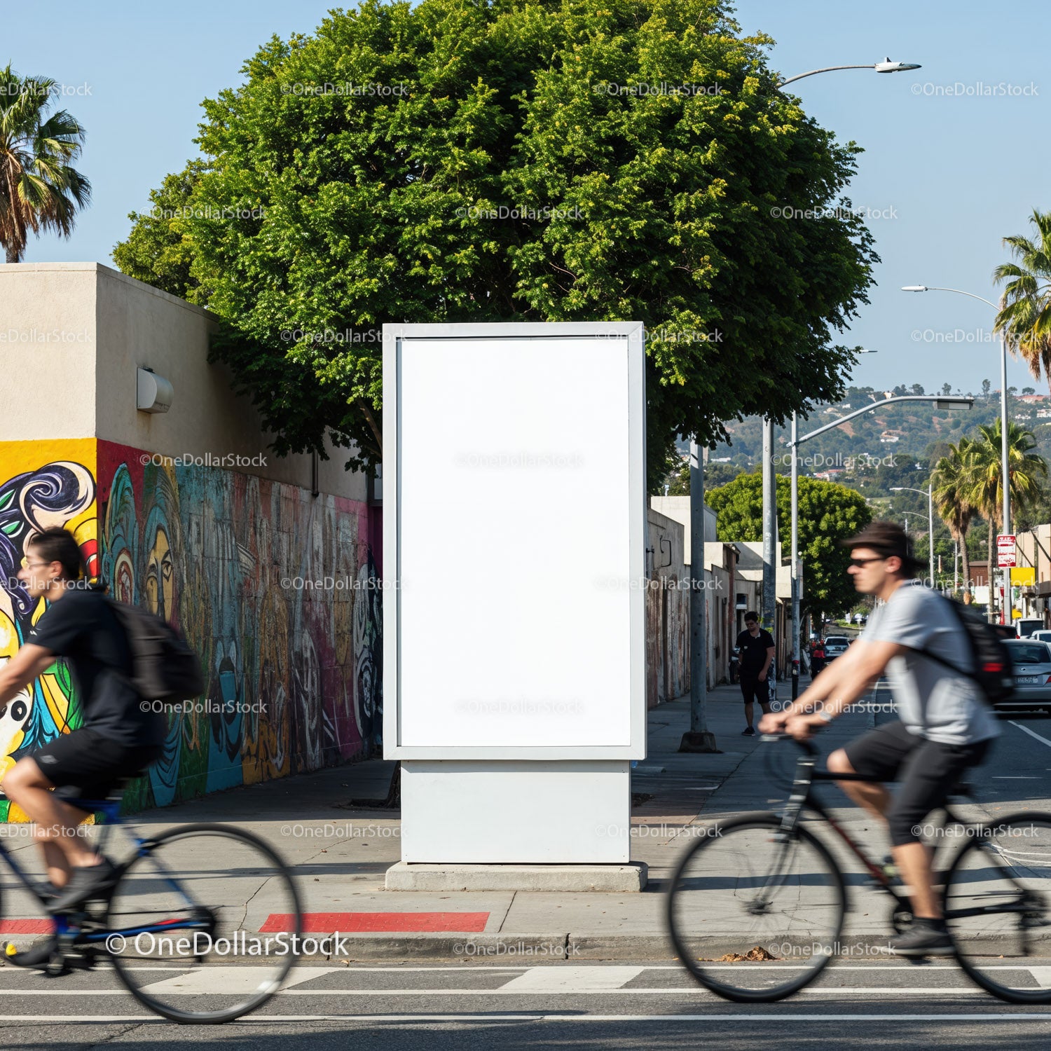 Urban street scene with blank billboard and cyclists
