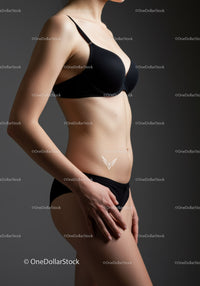 Elegant Woman in Black Lingerie Showcasing Feminine Silhouette