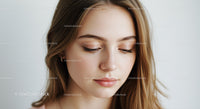 Close-up of a Beautiful Young Woman with Flawless Skin and Soft Expression