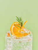 Refreshing citrus cocktail with rosemary garnish