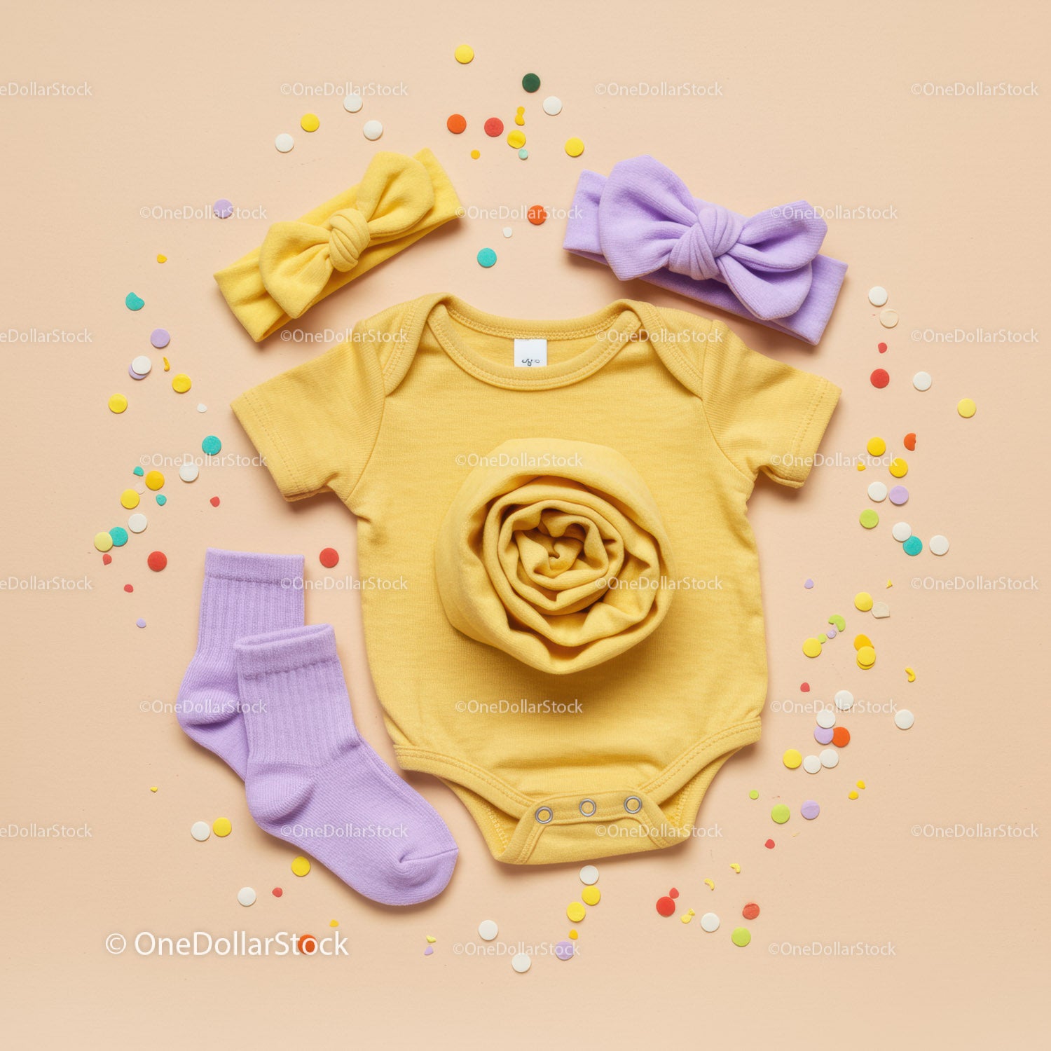 Yellow Baby Onesie with Lilac Accessories and Confetti