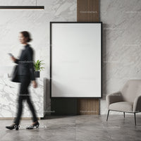 Modern office lobby with blank poster and businesswoman