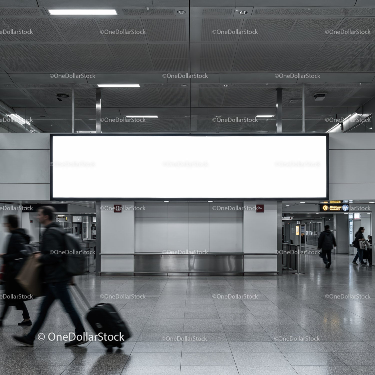 Busy airport hallway with large blank advertisement board