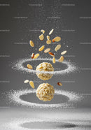 Floating Almond Truffles Surrounded by Sugar Dust