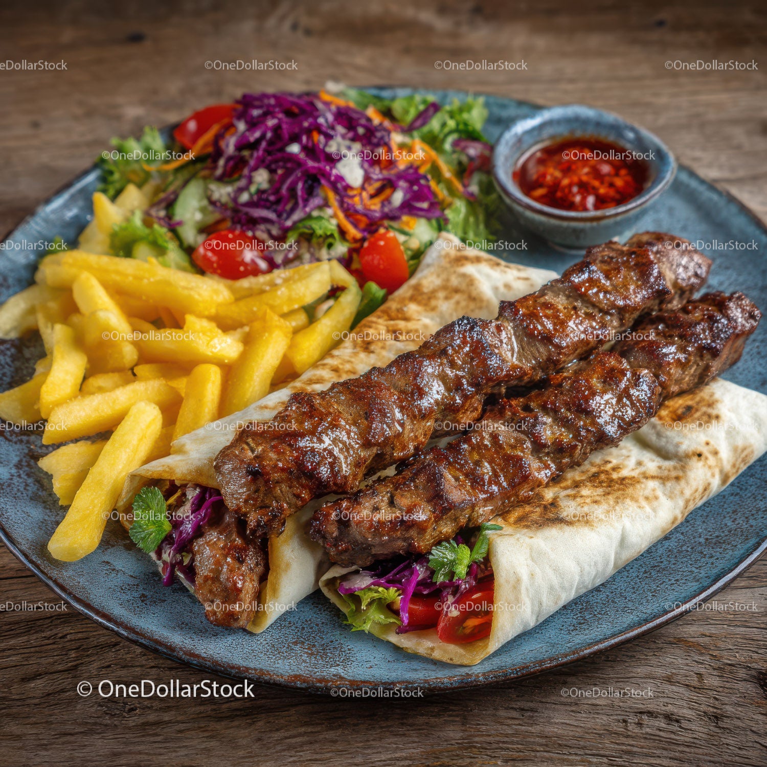 Grilled Lamb Kebab with Vegetables and Fries on Rustic Plate