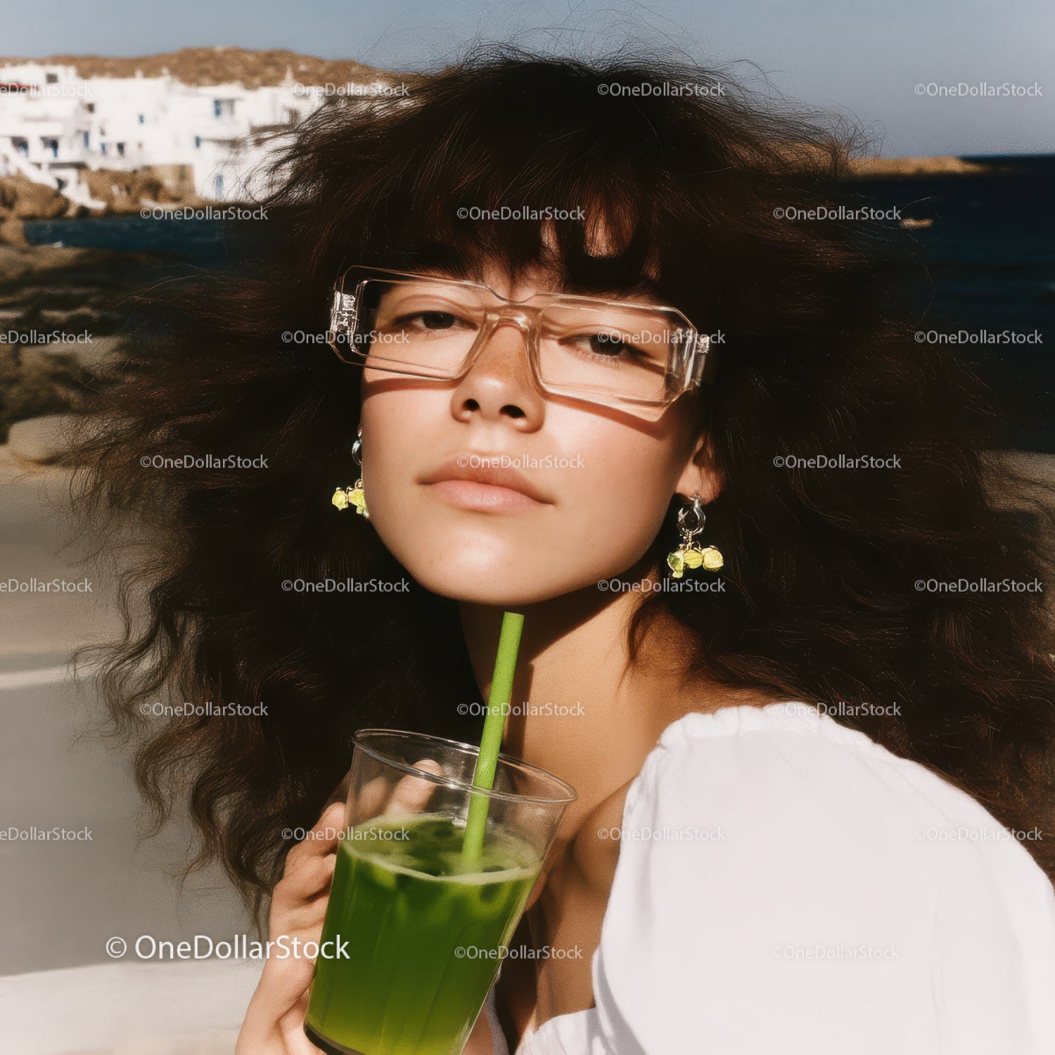 Stylish Woman with Green Drink at Seaside on Sunny Summer Day