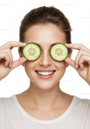 Woman with Cucumber Slices Over Eyes Fresh Skin Beauty Portrait