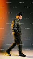Man walking thoughtfully in dark casual outfit