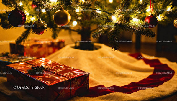 Christmas tree with festive gifts and glowing lights