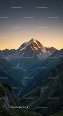 Majestic Snow-Capped Mountain Peak at Sunrise with Verdant Valley