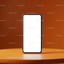 Modern smartphone with blank screen on orange table