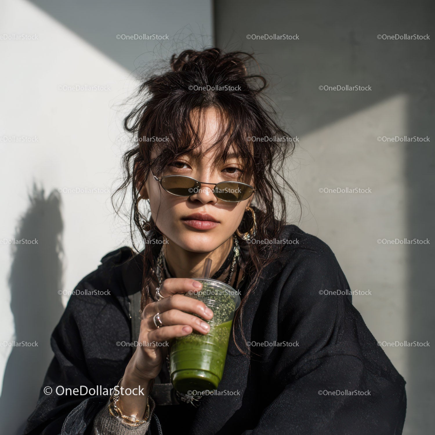 Trendy Woman Sipping Green Smoothie with Sunglasses and Edgy Style
