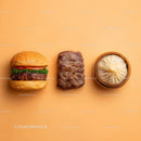 Gourmet Burger with Lettuce and Tomato Next to Grilled Steak and Dumpling