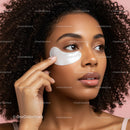 Beautiful Woman Applying Under Eye Patch with Curly Hair
