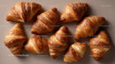 Assorted Croissants on Elegant Bakery Display with Warm Tones