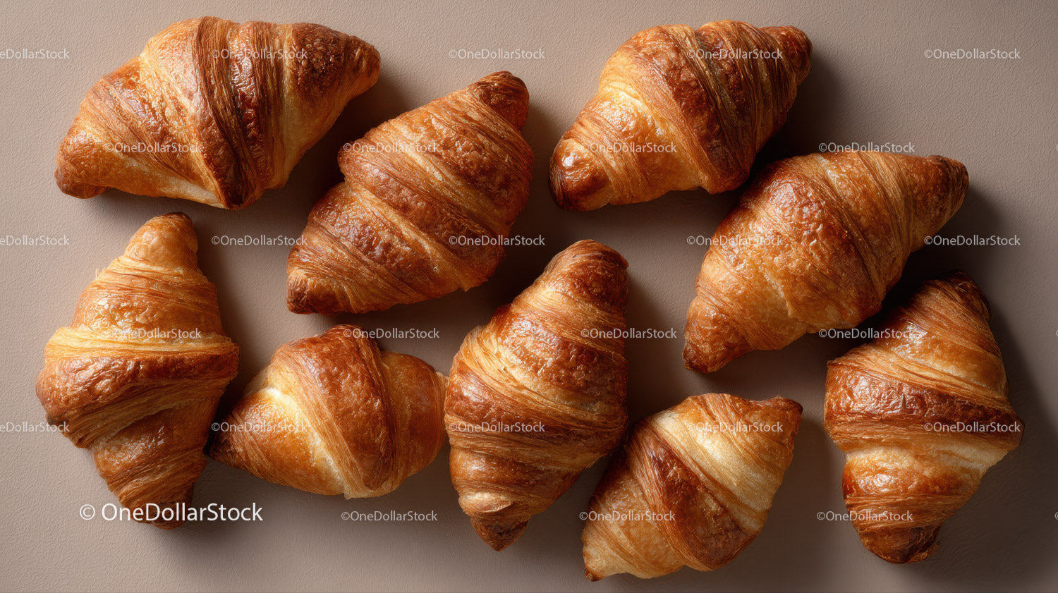 Assorted Croissants on Elegant Bakery Display with Warm Tones