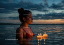 Woman in Black Bikini with Candles Floating in Lake at Sunset