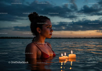 Woman in Black Bikini with Candles Floating in Lake at Sunset