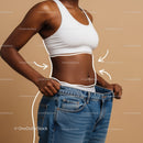 Woman Holding Oversized Jeans for Weight Loss and Body Transformation