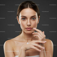 Young Woman Applying Lotion for Healthy Skin Against Dark Background