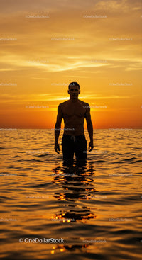 Serene Man Swimming in Ocean During Vibrant Sunset