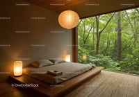Minimalist bedroom with forest view through large window
