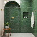 Modern green tiled bathroom shower with wooden stool