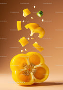 Sliced yellow bell pepper with seeds falling