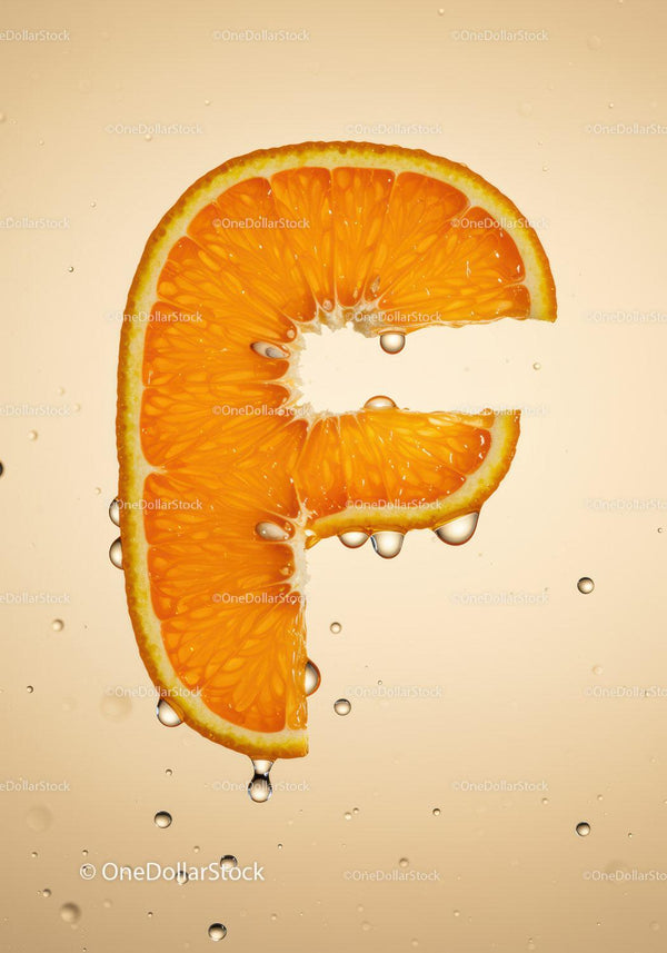 Fresh orange slice shaped like letter F with water drops