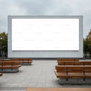 Empty outdoor seating area with large blank billboard