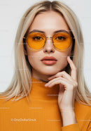 Fashionable Woman in Orange Turtleneck with Yellow Sunglasses