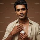 Elegant Portrait of a Man Applying Moisturizer for Skin Care