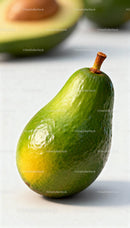Fresh whole avocado with ripe fruit in soft light