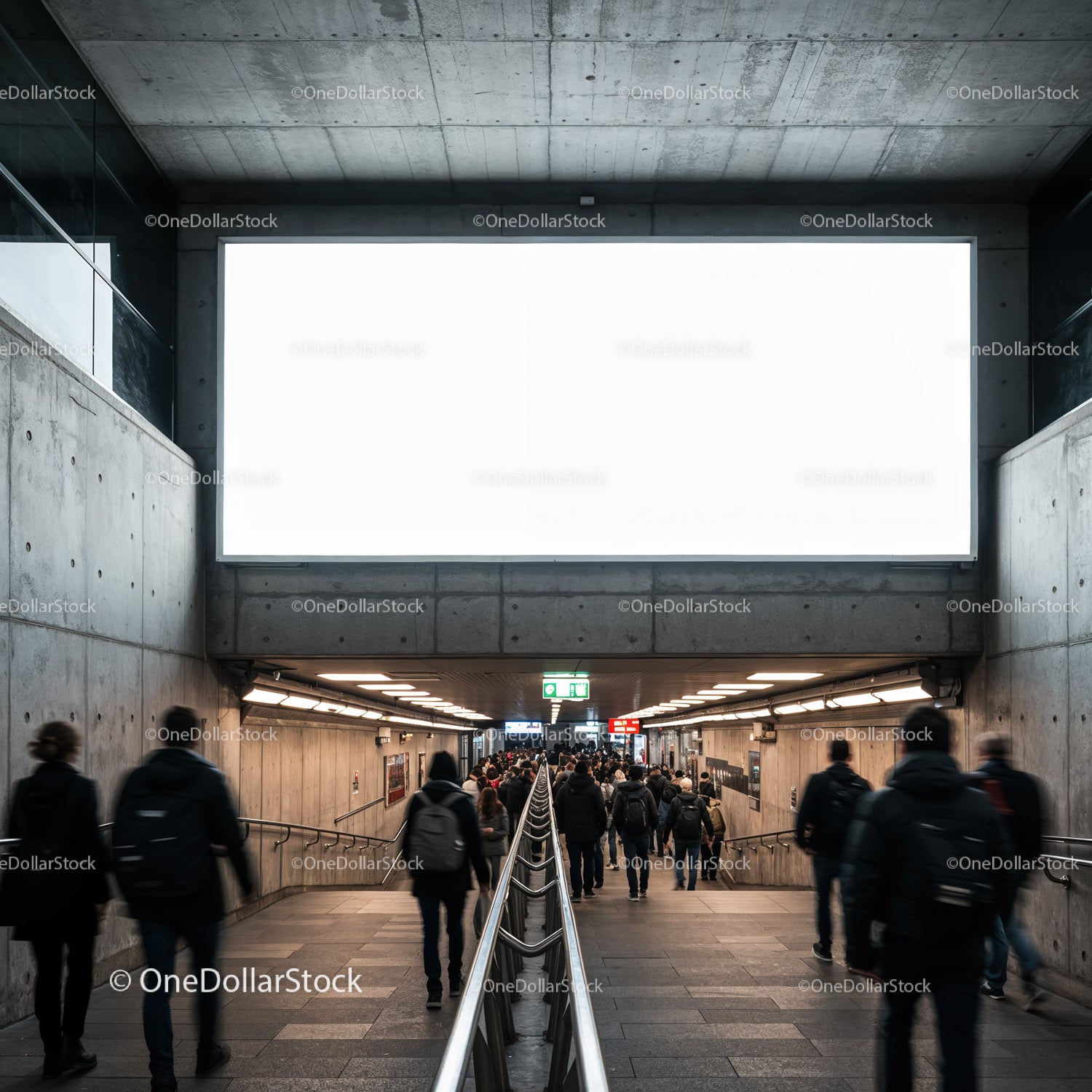 Busy underground passage with commuters and blank billboard