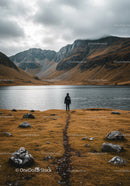 Serene Mountain Lake Scene with Person Exploring Scenic Wilderness