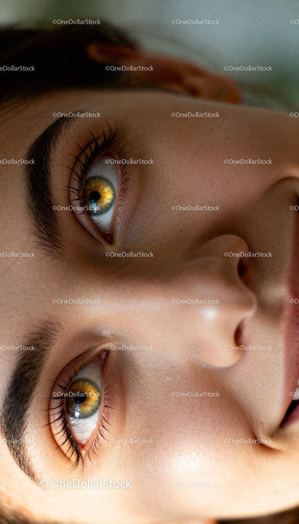 Close up of woman’s face highlighting amber eyes