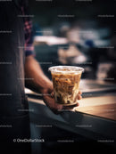 Refreshing Iced Coffee in a Clear Glass with Swirling Milk