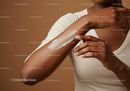 Close-up of Woman Applying Lotion on Arm Demonstrating Skincare Routine