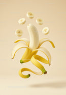 Peeled banana with floating slices and peel spirals