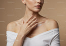 Elegant Woman Applying Moisturizer on Shoulder for Healthy Skin