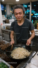 Chef Preparing Delicious Noodles in a Modern Kitchen