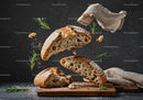 Rustic sourdough bread slices floating with herbs