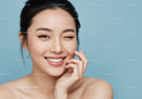 Joyful Asian Woman with Flawless Skin and Playful Smile